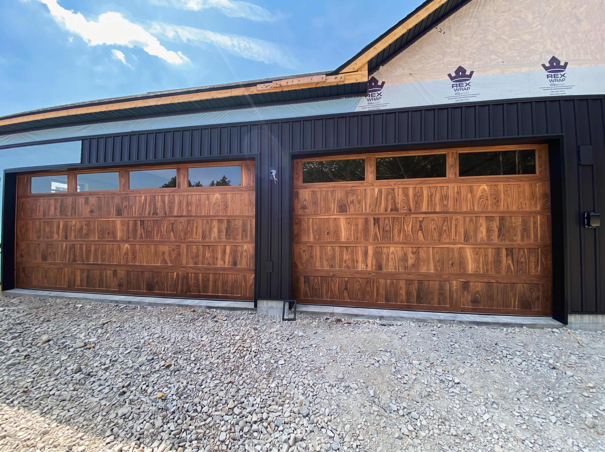 Walnut-look garage doors installed by Track & Timber Co.